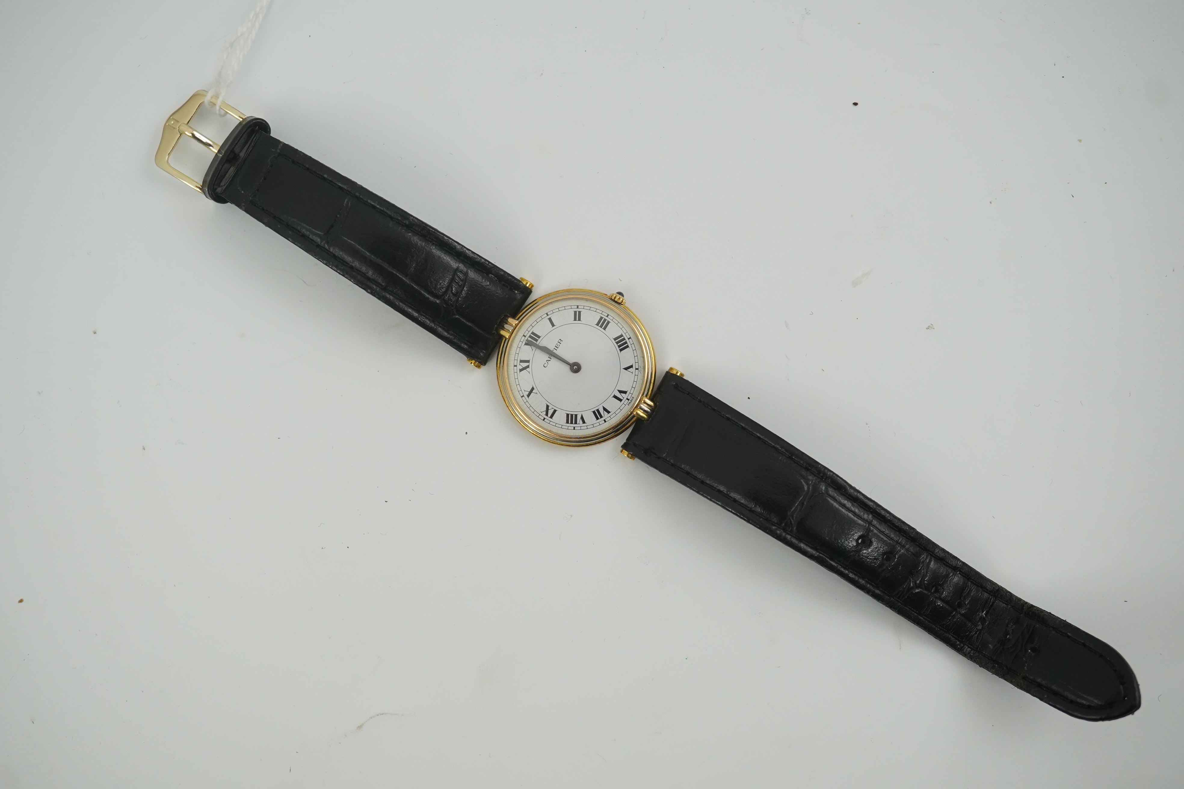 A modern 18ct gold Cartier Vendome quartz wrist watch, on an associated leather strap